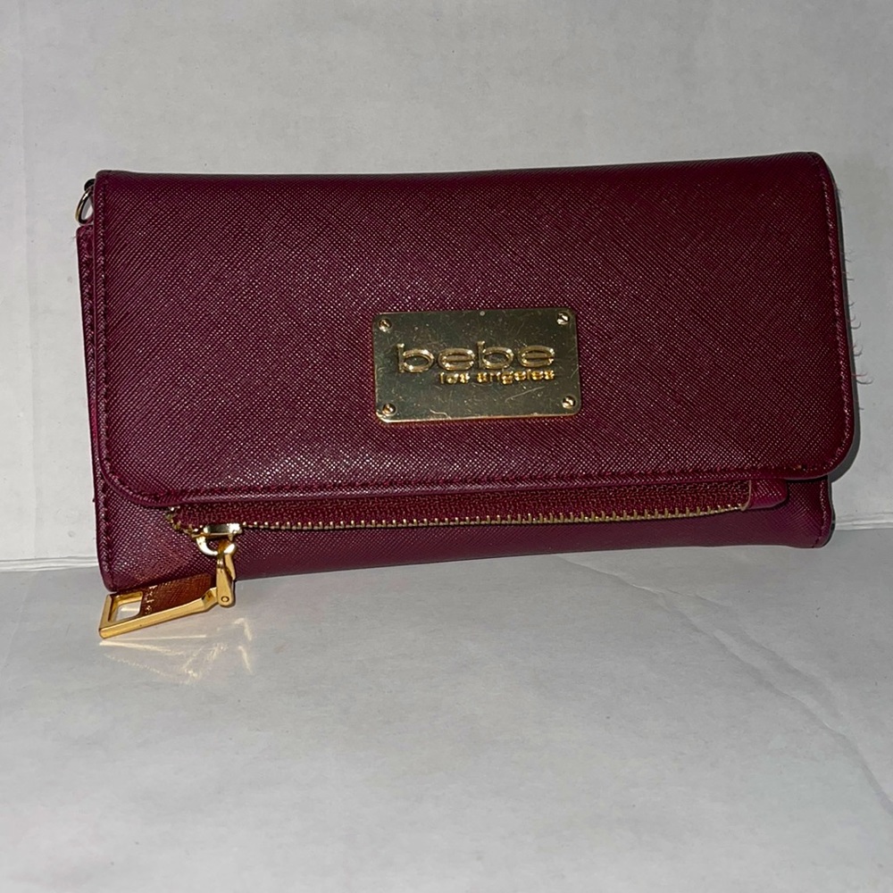 Lightly used maroon Bebe wallet